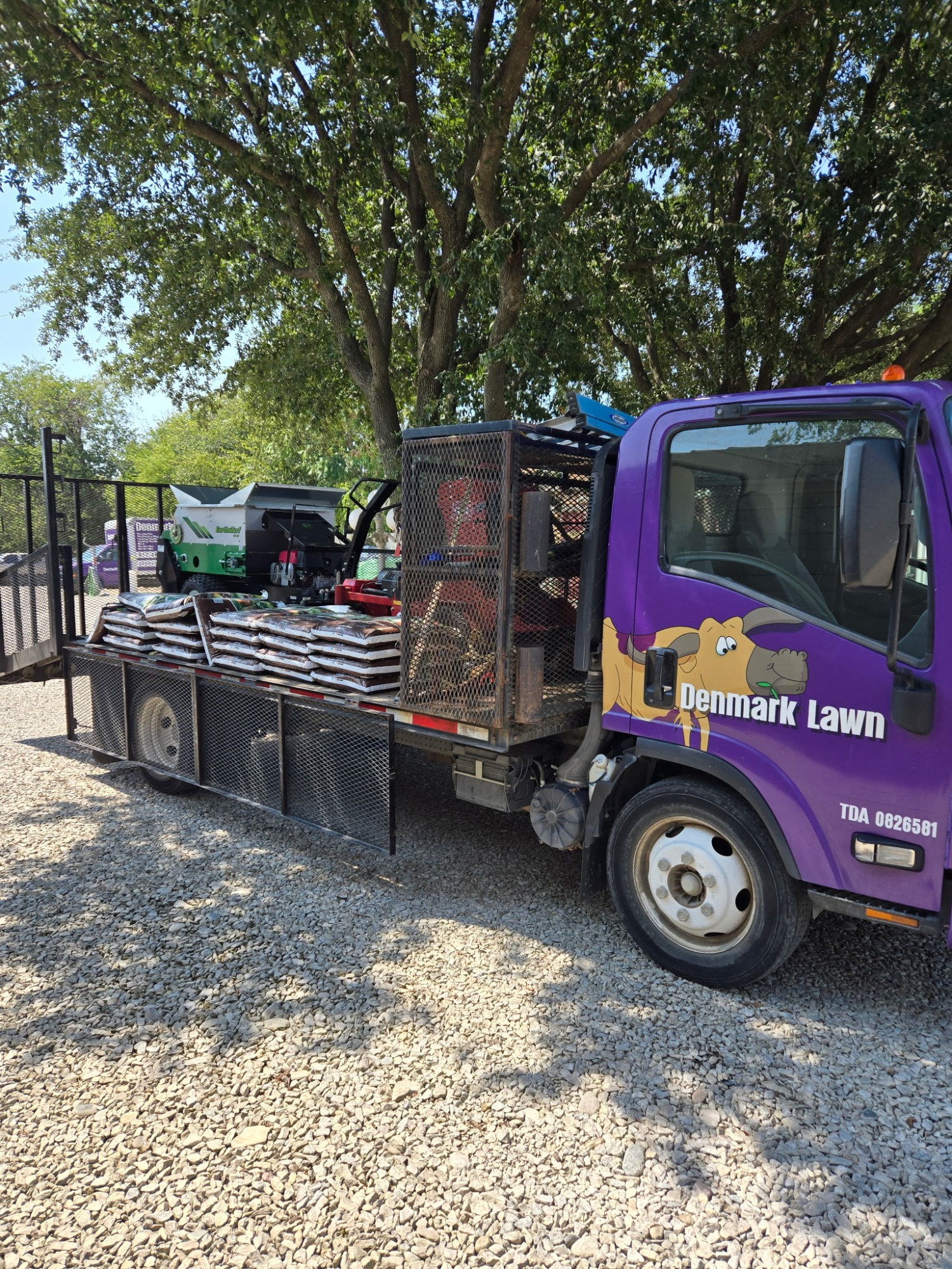Denmark Lawn flatbed loaded with landscape materials